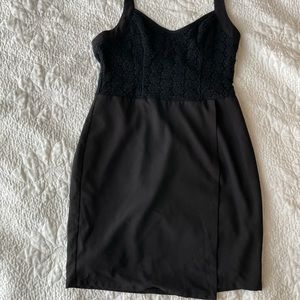 Halter top asymmetrical form fitting black dress